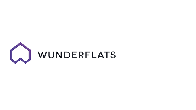 Neben einem lilafarbenen geometrischen Figur, wie ein Haus steht „Wunderflats“.